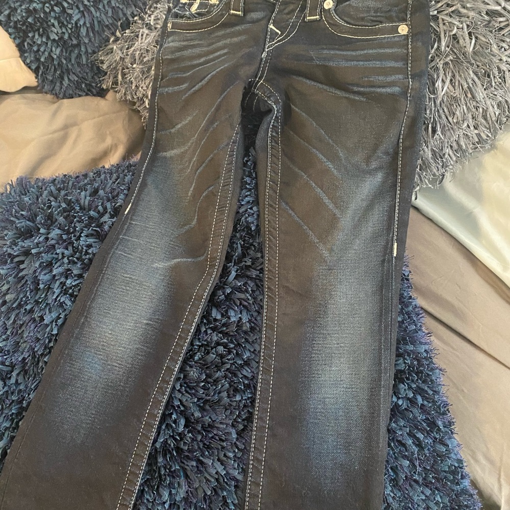 Faded dark rinse True Religion jeans size 23